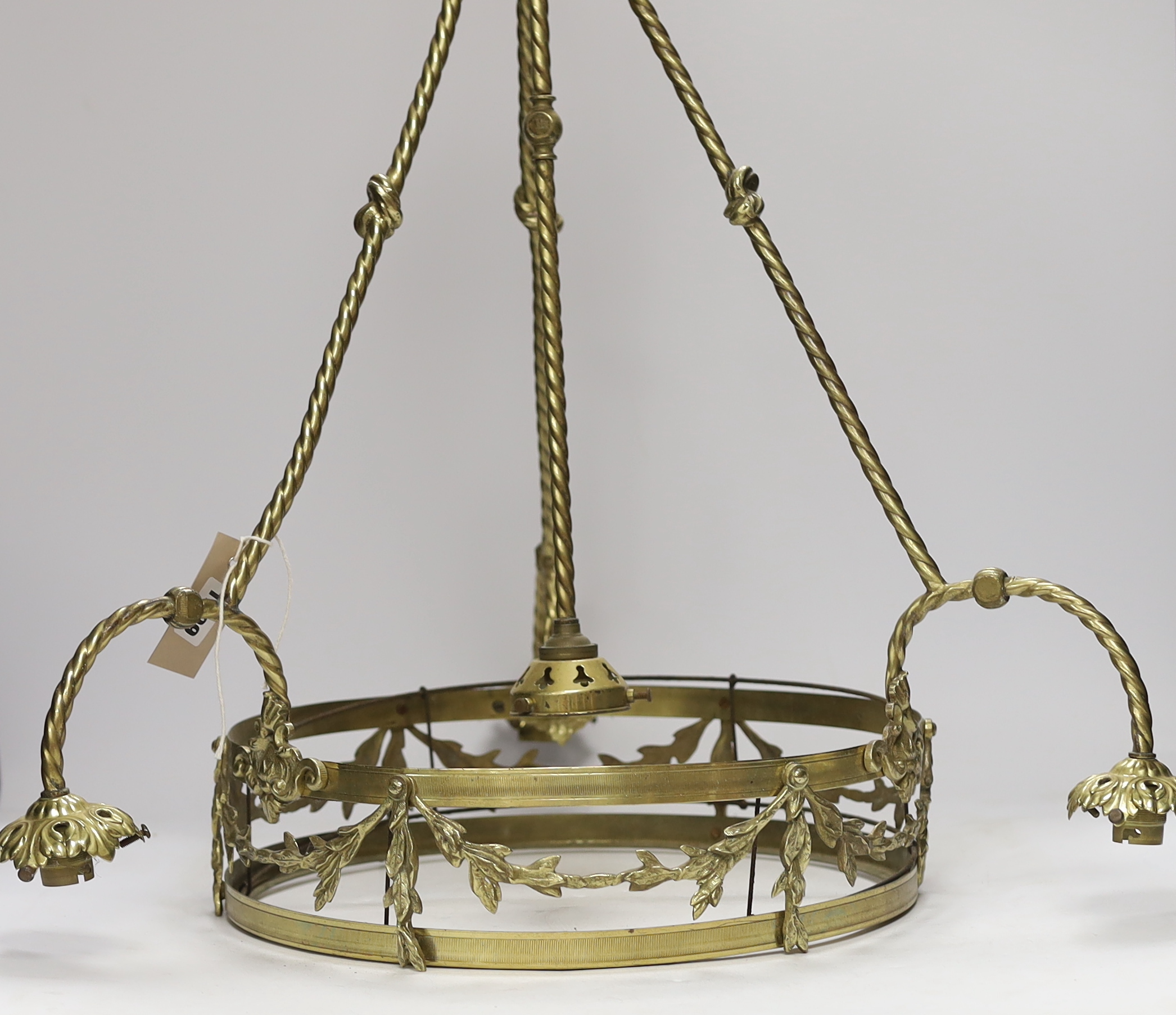 A brass three branch (four light) electrolier and four etched glass shades, 64cm high